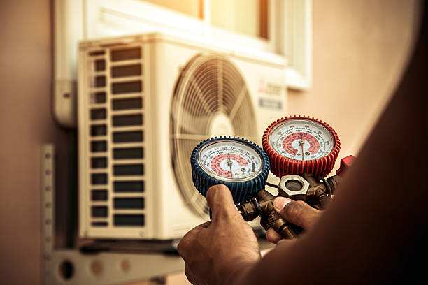 Professional Ac Installation technician working in Olmstead, KY